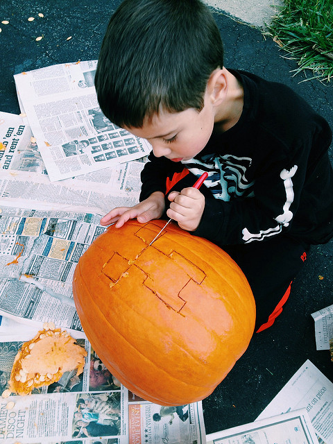 Kids carving pumpkins Kids carving pumpkins