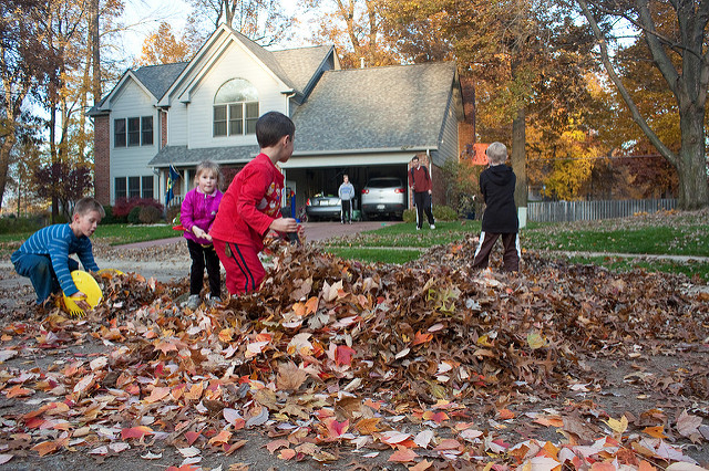 Kids playing in leaves via The Risky Kids Kids playing in leaves via The Risky Kids