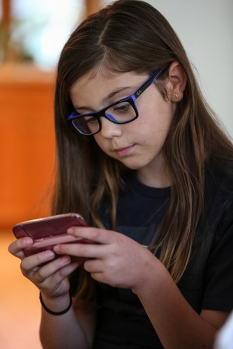 Tween with cellphone Tween with cellphone